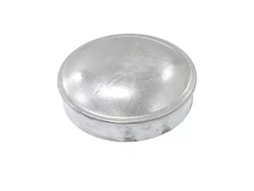 A small round metallic cap or cover.