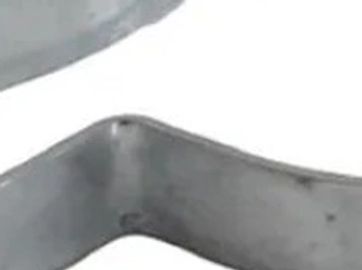 Close-up of a bent metal piece.