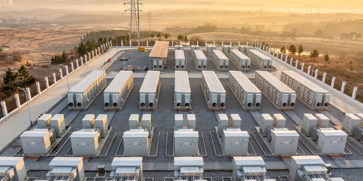 Aerial view of a power facility with multiple generator units.