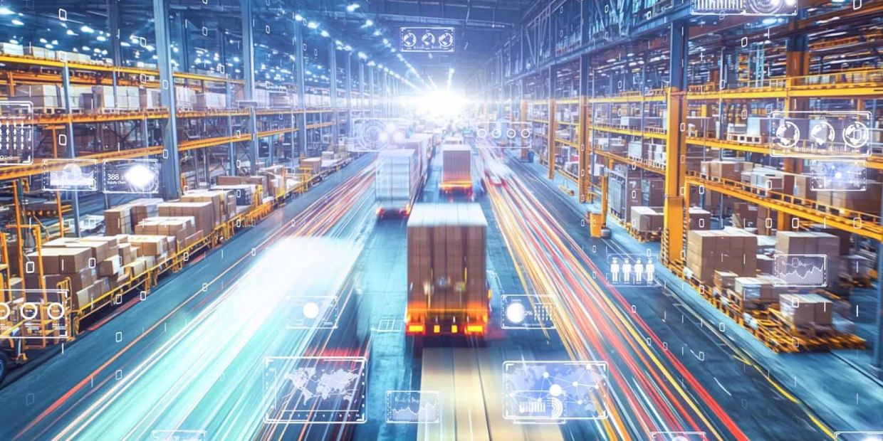 Warehouse with moving trucks and digital overlays.