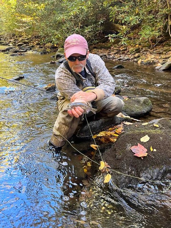 Fly Fisherman in float tube trout fishing the Hiwassee River