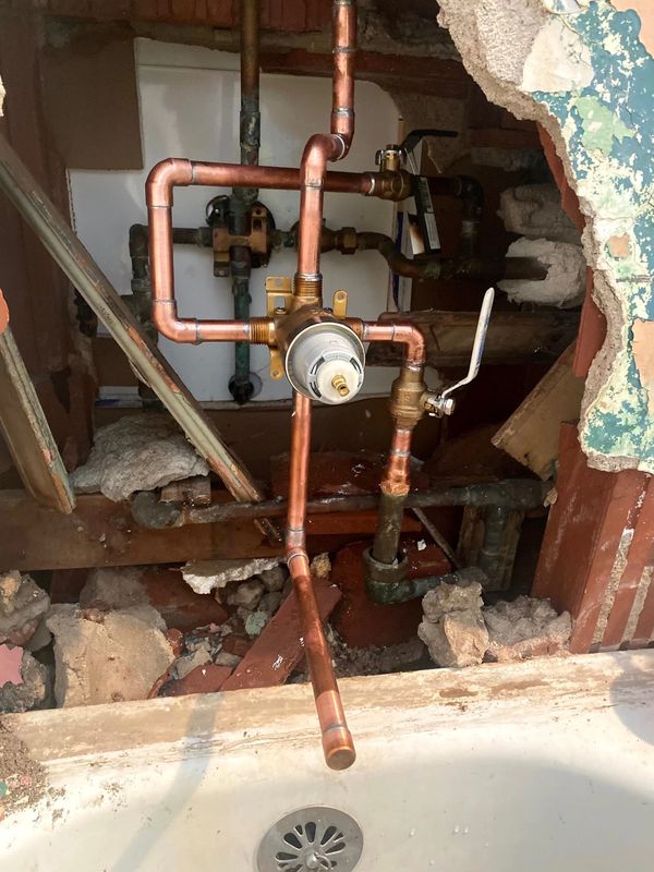 Copper piping connected to shower diverter