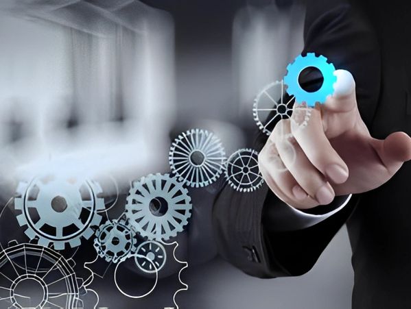 Businessman hand draws gear to success concept
