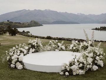 White wedding ceremony platform for bride and groom to get married 