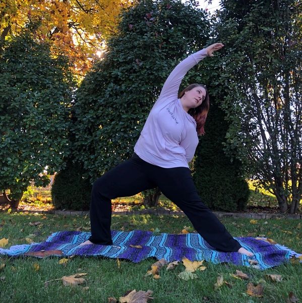 Lauren practicing yoga outside