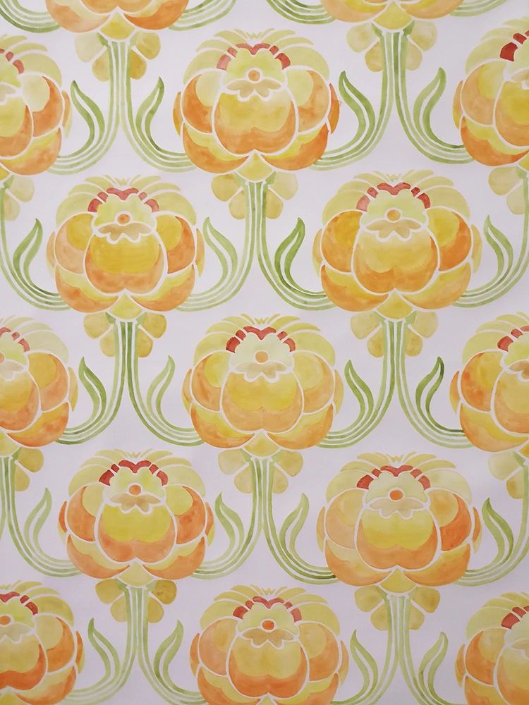 Pattern of orange and yellow stylized flowers with green leaves on white background.
