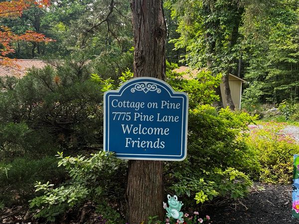 Welcome sign for Cottage on Pine at 7775 Pine Lane.