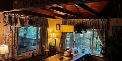 Cozy rustic dining area with natural views.
