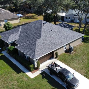 Street view of a completed roof replacement.