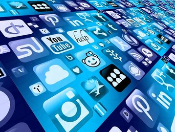 Grid of social media and app icons displayed on a blue digital background.