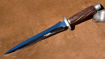 Dagger with turned wooden handle and mirror finish blade by Robert Champion