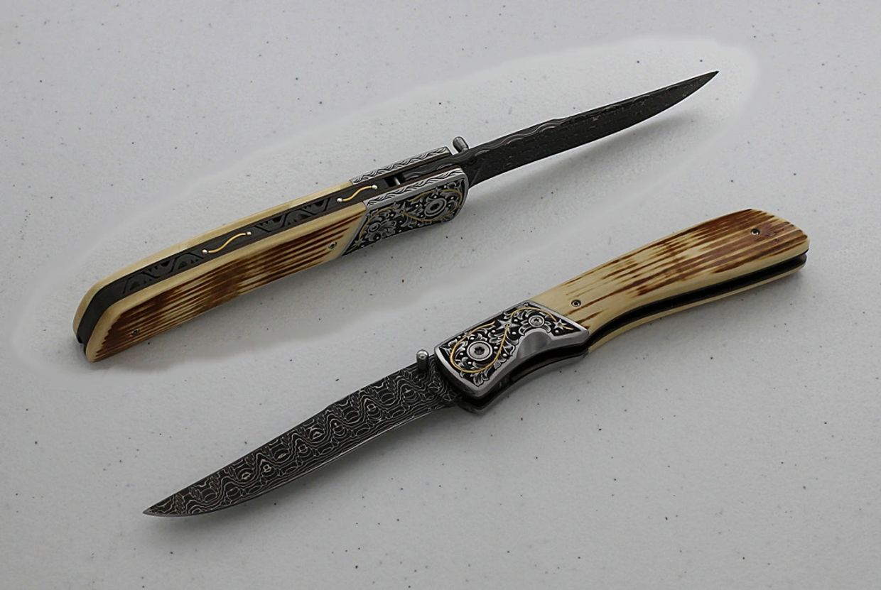 Panhandle Slim folder knife engraved with 24K gold & silver by Robert Champion