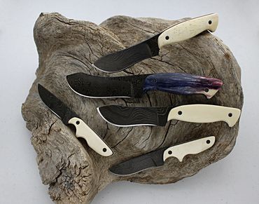 Skinner and Snowcat knives with bone handles by Robert Champion
