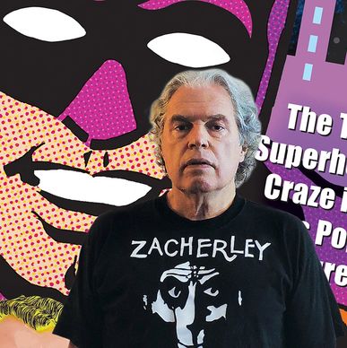 Man standing in front of a colorful superhero comic background.