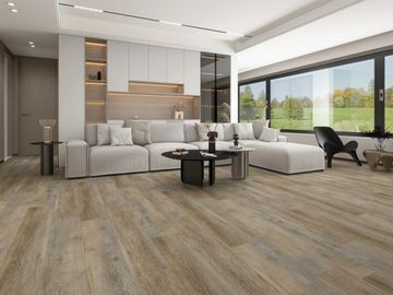 Modern living room with large white sectional sofa and wooden flooring.
