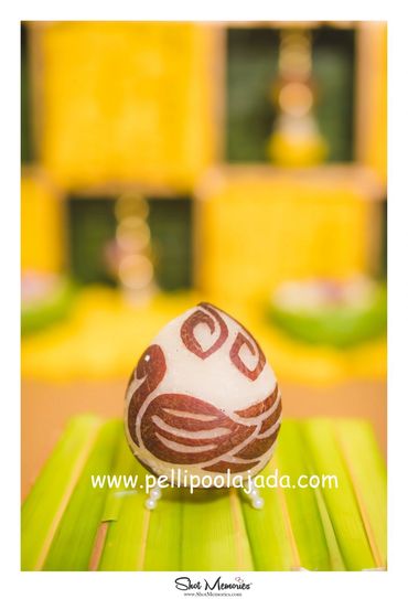 Pellipoolajada_KobbariKudukalu_Vijayawada: Carved dry coconut with peacock bird carved