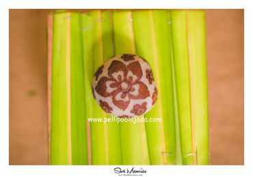 Pellipoolajada_KobbariKudukalu_Warangal: Carved dry coconut with flower crafted