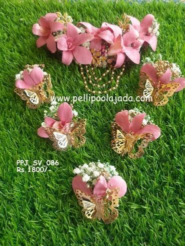 Pellipoolajada_FreshFlowerVeni_Mumbai: baby pink color Veni with butterfly clips and tassels