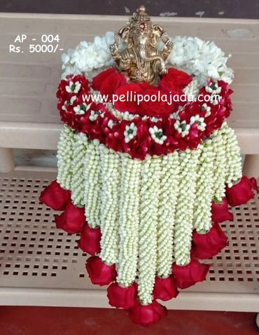 Pellipoolajada_AarthiPlateDecor_Vijayawada:  with thick strands of  mallepoovu rose petals crafted