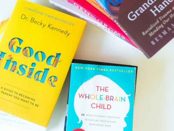 Books on parenting and psychology, including "Good Inside" and "The Whole-Brain Child".