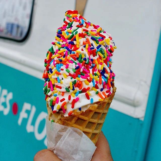 vanilla ice cream cone with rainbow sprinkles