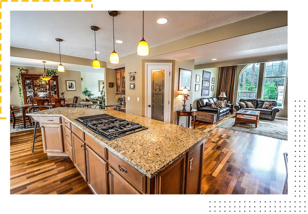 Kitchen with granite stone countertops and mismatched wood flooring