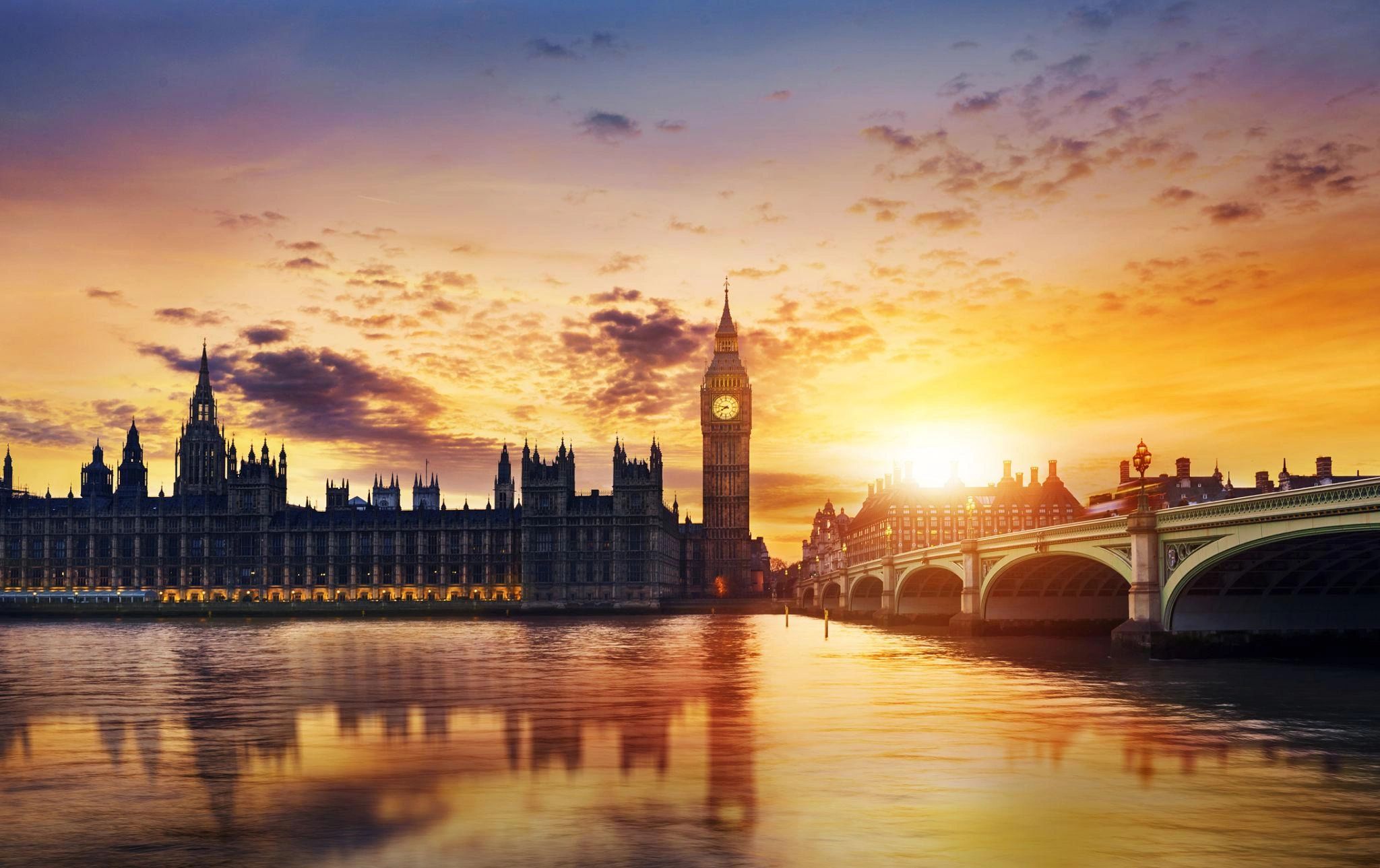 Sunset over Big Ben and Westminster Bridge in London.