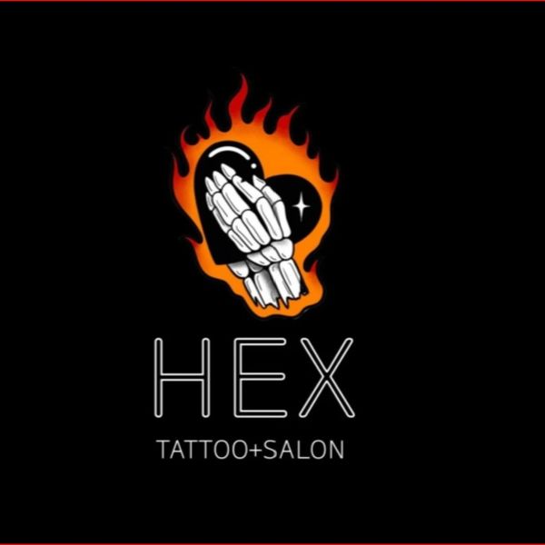 Flaming heart with skeletal hands logo for HEX Tattoo + Salon.