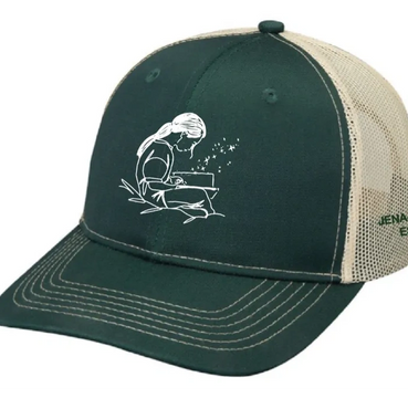 Green and beige cap with a white sketch of a girl reading a book.