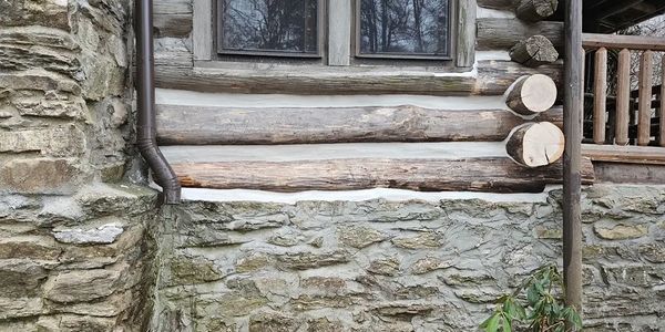 Chinking and log repair on Wisconsin Log Cabin