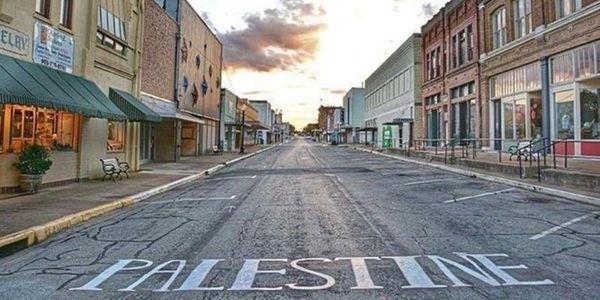 Empty street with Palestine painted on the road.