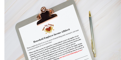 Household Employee Income Affidavit on a clipboard with a pen.