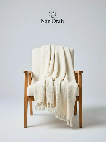 Bring natural comfort and elegance to your home with this 100% organic cotton blanket from Nan Orah.