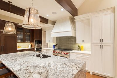 a kitchen with lights and cabinets 