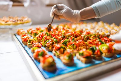 appetizers on a blue mat on elevated surface