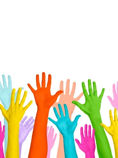 Colorful painted hands raised against a white background.