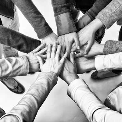 Closeup shot of many people hands on eachother