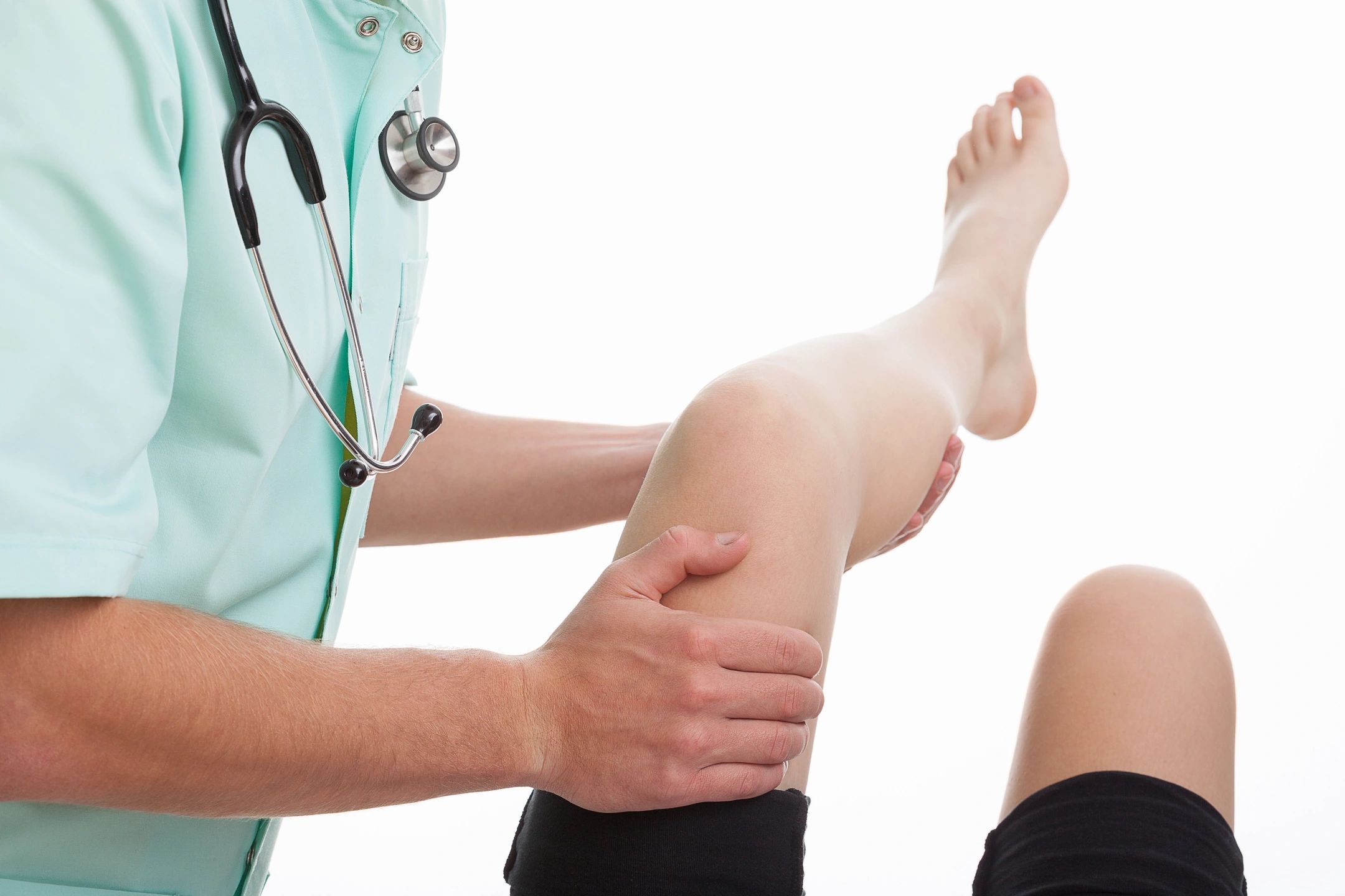 a professional treating a woman's knees