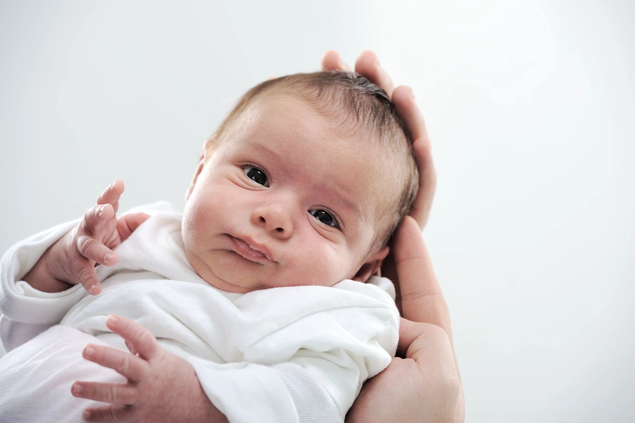 baby being held, newborn baby