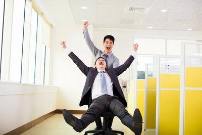 Business coach celebrates success with their client.