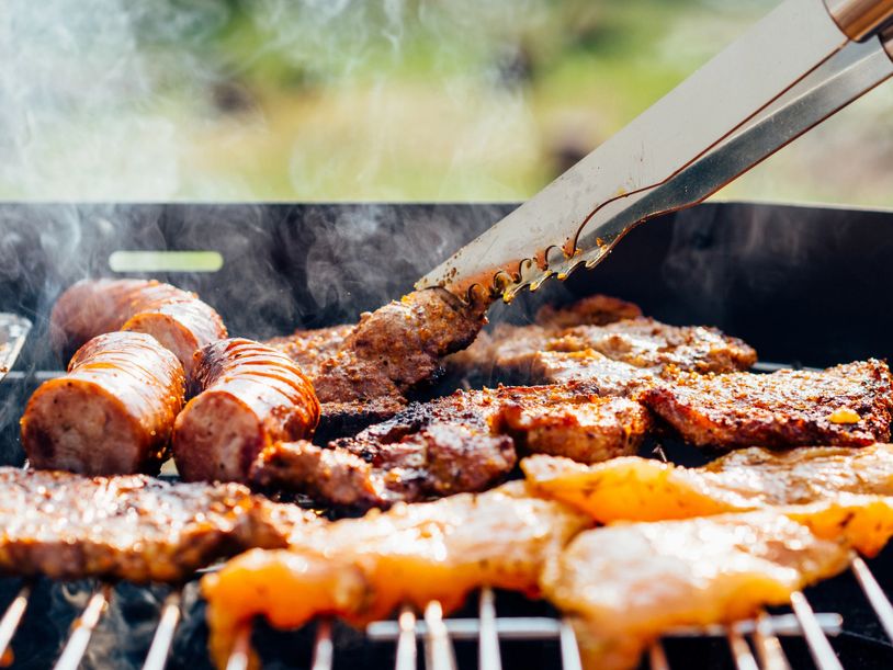 meats on bbq - sausages, steaks and chicken