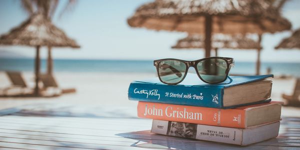A stack of books to read while on vacation