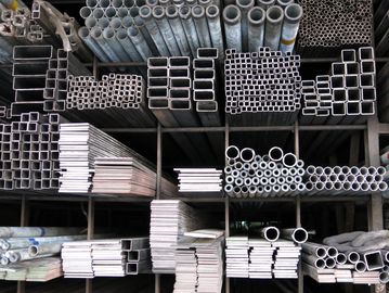 Organized metal pipes and tubes of various shapes.