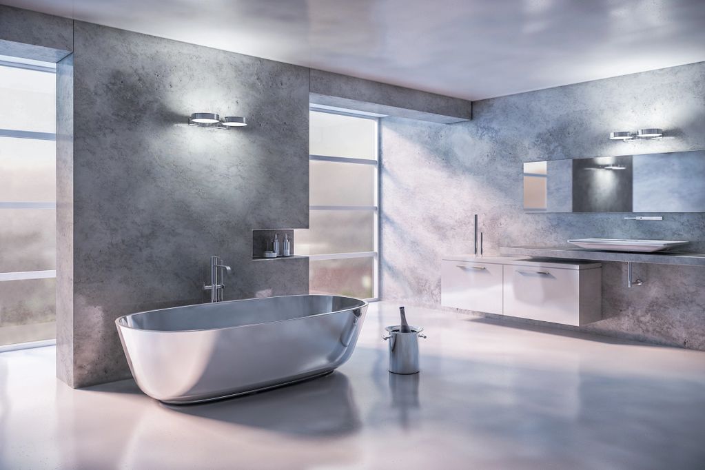 Modern bathroom with a sleek metal bathtub and minimalist design.