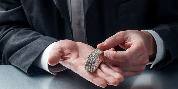 A person holding an expensive bracelet.