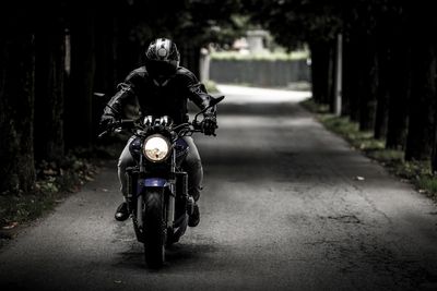 Man riding a motorcycle on the street - Motorcycle Accident Attorney