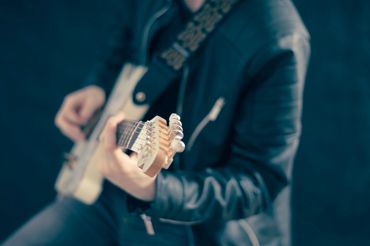 Man playing a guitar.