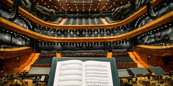 A view into a concert hall from the perspective of the performer on stage.