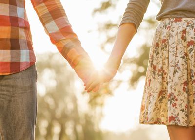 A man and a woman holding hands