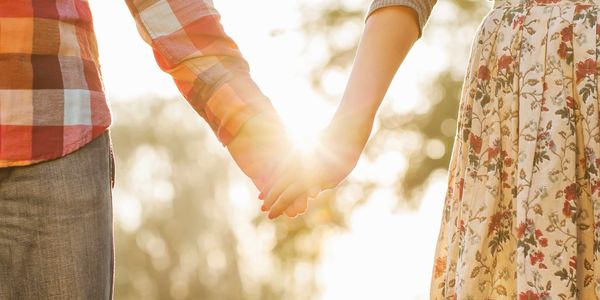 Close up image of a couple holding hand